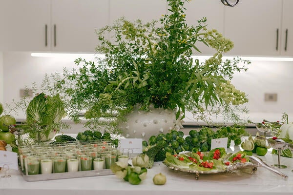 An effusive arrangement by Fox Fodder Flowers in a Grenell vase from Arteriors complemented the vibrant spread by Bad Taste