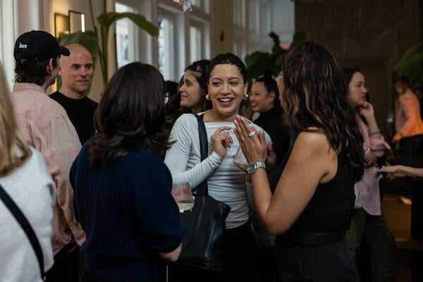 Adam Elzer, Earleen Gonzalez and guests in conversation during the event