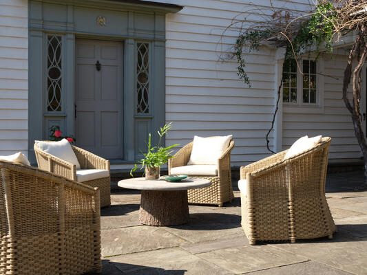 The Woodland outdoor coffee table has a strikingly realistic tree-trunk base