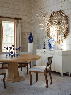 New Devon dining chairs surround the Haven dining table, which features a 72-inch top