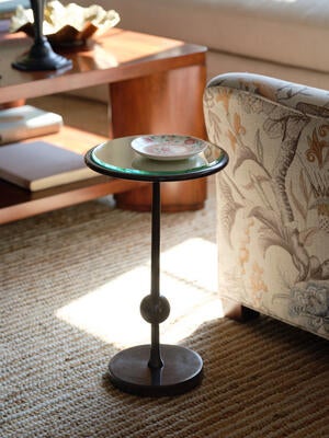 The popular Burke drinks table is now available with an oil-rubbed brass base that mimics bronze