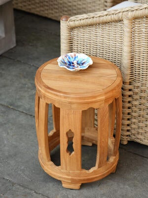 The Mozi outdoor garden stool is crafted from sustainably sourced, fine-sanded, unfinished teak