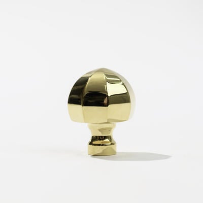 The Normandy knob in unlacquered polished brass, designed by Suzanne Kasler for Art & Forge
