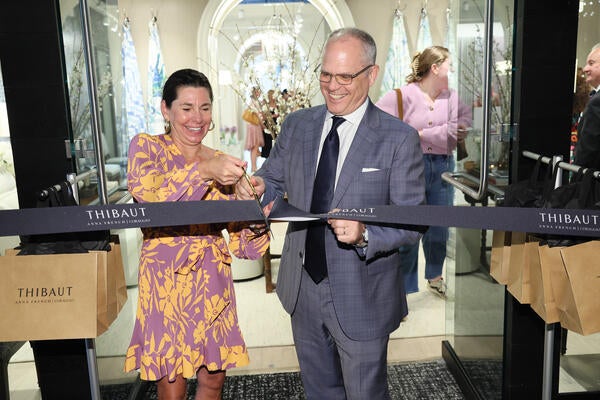 Andrea Eckberg and Rick Kilmer cut the ribbon to
commemorate the official showroom opening