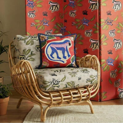 Monkey Palm in Sunset (room divider) and Savannah (upholstery) with Meandering Monkey cotton pillow in sunset