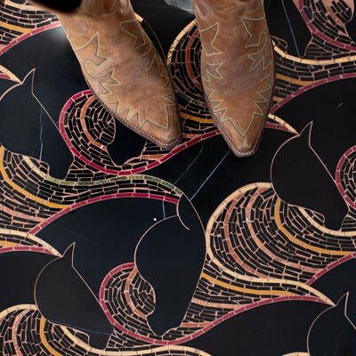 Herd, a hand-cut and water-jet stone mosaic, is part of the Saguaro collection by New Ravenna