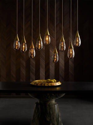 Giselle linear multi-port chandelier, Forgey dining table, Everett centerpiece