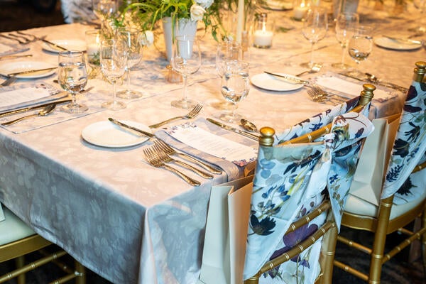 Table setting with custom linen and scarves from Domain of the Flowerings