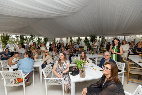 Guests captivated by a panel discussion in the tent