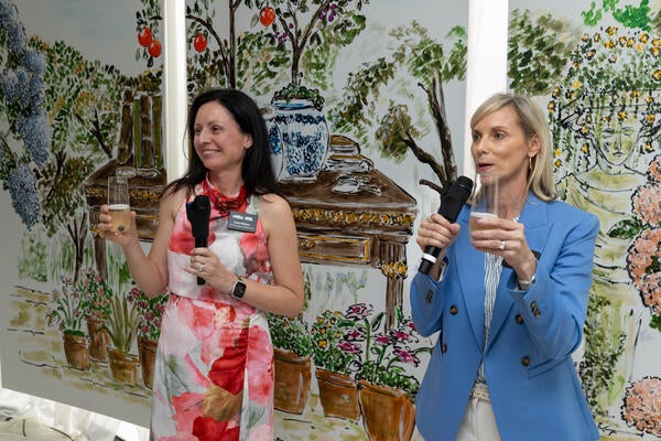 NKBA’s chief marketing and digital officer, Ivana Molzen, and vice
president of operations and KBIS, Deb Webb, give a toast at “The Spring Edit” reception