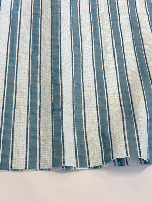 Strié hand block printed and embroidered textile in Ciel Blue.