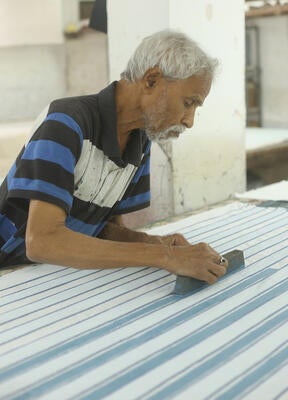 Strié hand block printed and embroidered textile in Ciel Blue.