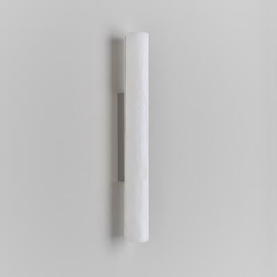 Lulworth wall light: The lacquered alabaster shade is hollowed from a solid piece of Spanish stone
