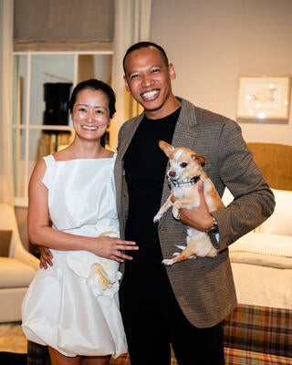 DuVäl Reynolds, his wife, Sara, and their dog, Queso, are all smiles