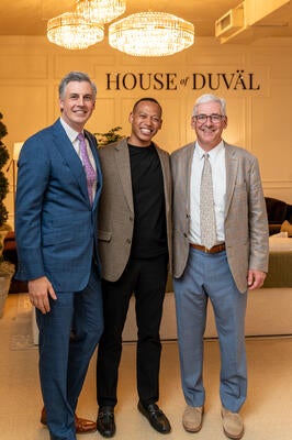 Reynolds flanked by Tom Zaliagiris, senior vice president of sales and marketing, and Thad Monroe, president of Sherrill Furniture