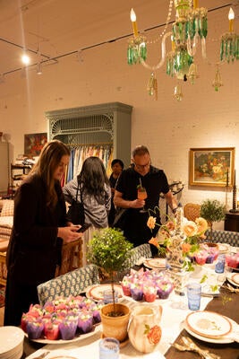 Guests mingled while viewing the new assortment of textiles, decor and accessories