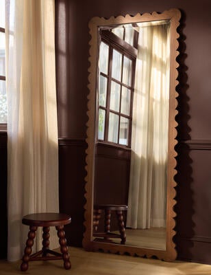 A scalloped shape lends playful charm to the Longton mirror
