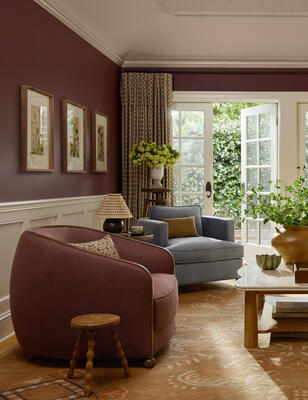 Soft curves blend with sculpted oak in the Darwen accent chair