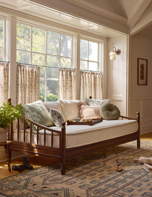 Turned legs and sleek spindles bring quintessential charm to the Adlington daybed