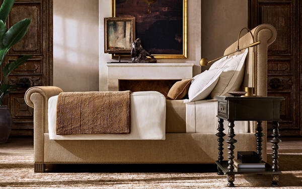 Vendôme bed with footboard in Camel performance velvet, shown with the Paloma bedside table