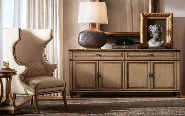 Paloma sideboard in Taupe, shown with the high-back English wing chair