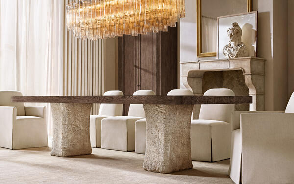 Lourdes dining table in cast stone and European white oak, shown with Monastère dining chairs