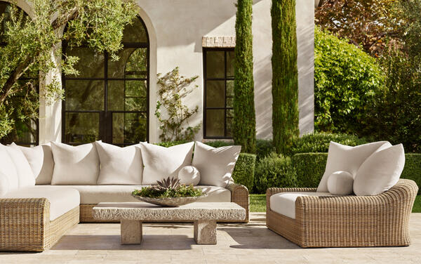 Jennifer outdoor sectional in all-weather wicker, shown with the Stonehenge coffee table