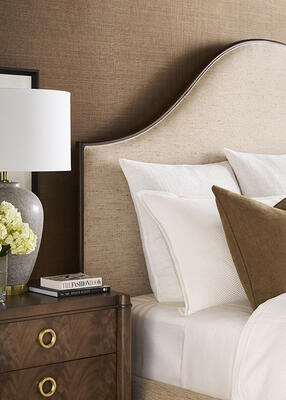 The elegant Rendition upholstered bed is wood-trimmed and can be customized in fabric or leather