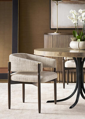 The Rendition dining table features a bleached crotch mahogany wood top and a metal base