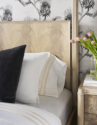 Crafted of flat-cut mahogany veneers, the Rendition poster bed dazzles in a light Latte finish