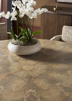 Exquisite bleached crotch mahogany veneers are expertly matched in the Rendition dining table