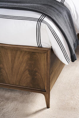 Bleached mahogany veneers distinguish the footboard and rails of the sophisticated Rendition bed