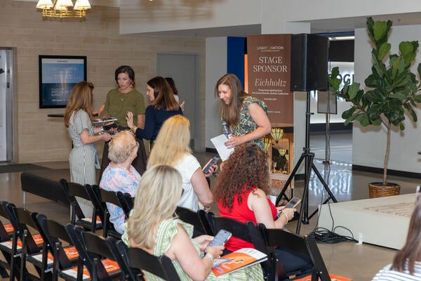 Kaitlin Petersen greets guests