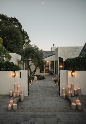 An abundance of hurricane candles cast the estate in a golden glow