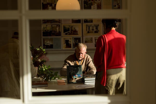 George Kiskaddon, owner of Builders Booksource in Berkeley, signed copies of Warner’s new book