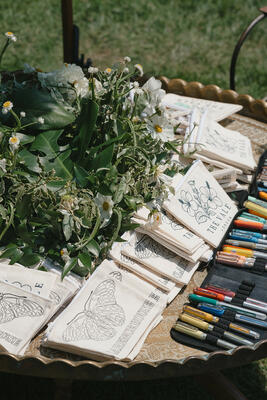 A table of bespoke coloring pouches adorned with patterns from The Vale London and Clarence House beckoned guests to relax and create 