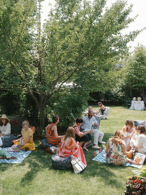 Guests enjoying an afternoon picnic on the lawn