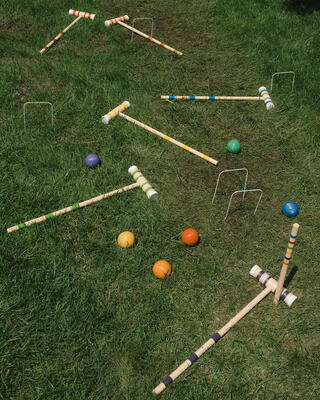 Colorful croquet mallets and balls 