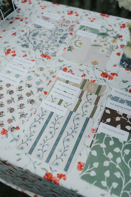 Fabric swatches and wallcovering samples from The Keeping House collection
