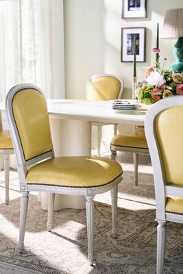 The Lydia dining chair pairs Maison Jansen spirit with French midcentury lines and turned legs