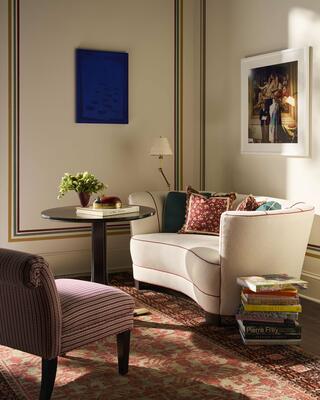 The Edwina sofa pairs a channeled back, compact scale and sculptural wood feet
