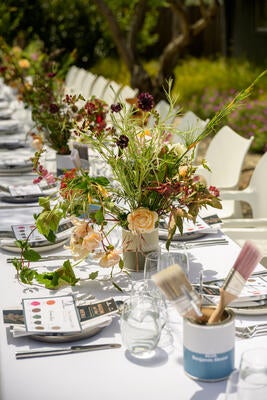 Seasonal florals and thoughtfully curated Benjamin Moore details set the stage for conversation and connection