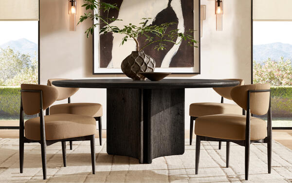 Serrano round dining table shown with Arno Luxe dining chairs in Camel performance linen weave