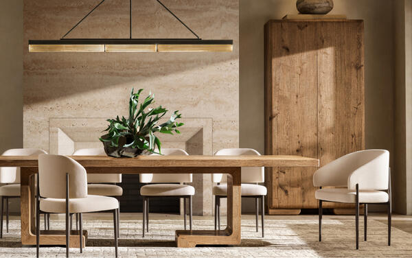 Monteiro dining table shown with Eva dining chairs in natural performance boucle