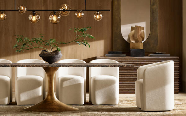Aero stone dining table in Brown Emperador marble shown with Aurelie barrel-back dining chairs