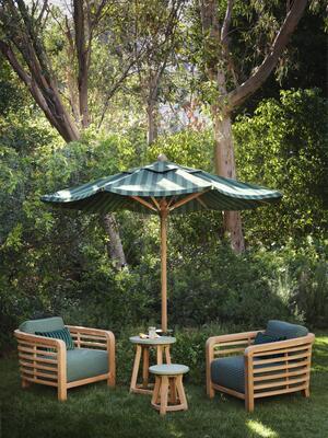 Trellis lounge chairs in Highball in Emerald pair with the Oval and Round occasional tables