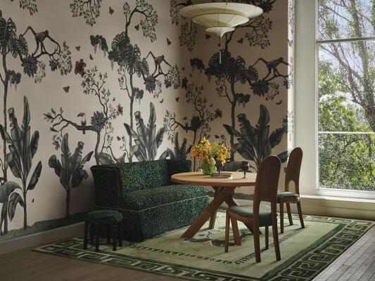 Monkey Business wallcovering pairs with a banquette upholstered in Untamed in Emerald
