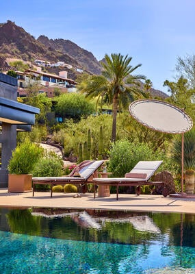 Shade overhead, chaises below. Comfort and conversation settle where you put them