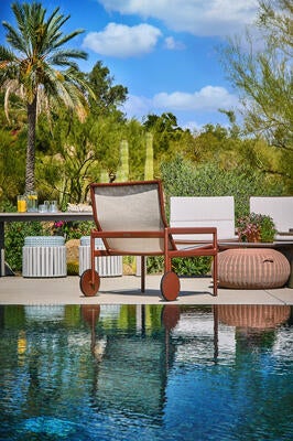 Sonora’s iconic lounge chair at the water’s edge. Airy in silhouette, as refined as it performs