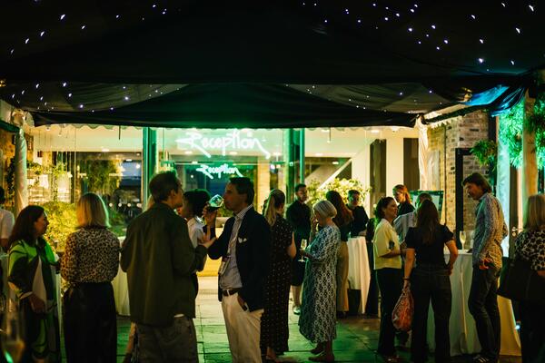 Designer guests mingling during cocktail hour